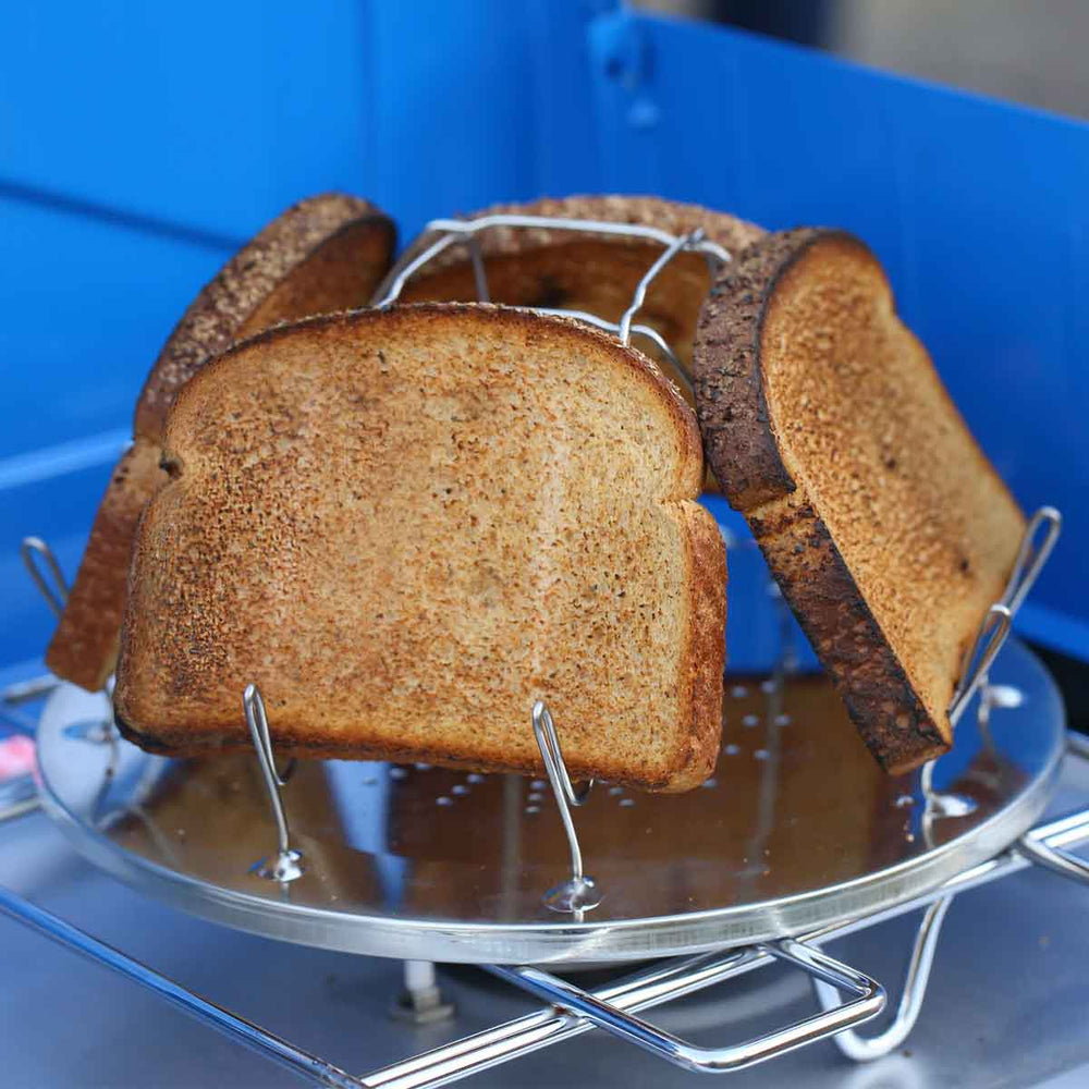 4-slice capacity Coghlan’s Camp Stove Toaster on a camp stove