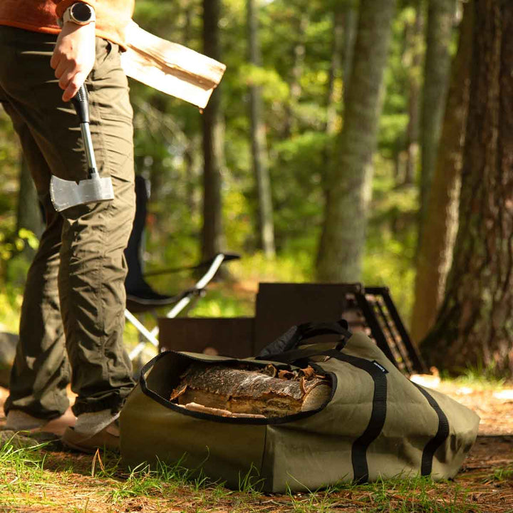 Firewood transport bag with hook-and-loop handle closure